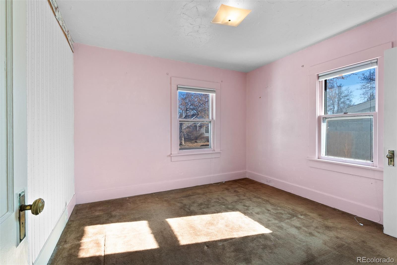 5919 South Bemis Street Littleton, CO 80120 - Photo 30 of 43 a view of an empty room with a window
