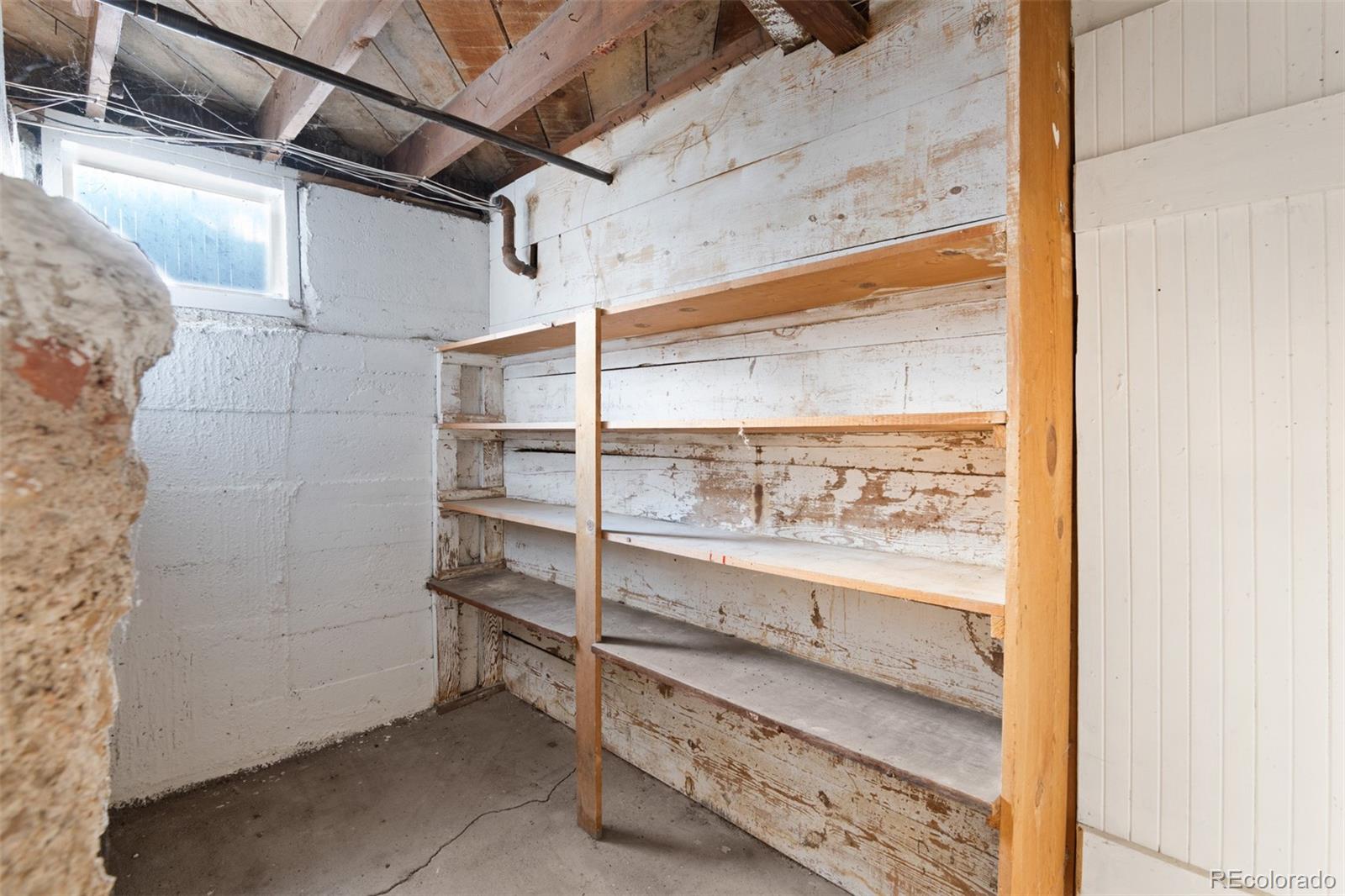 5919 South Bemis Street Littleton, CO 80120 - Photo 33 of 43 a view of walk in closet with empty racks