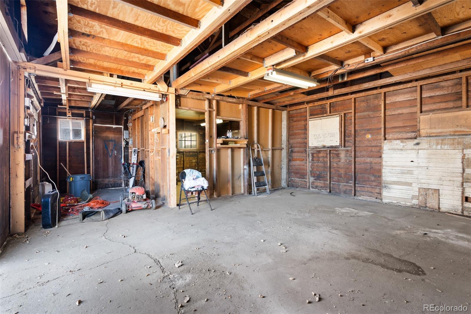 5919 South Bemis Street Littleton, CO 80120 - Photo 35 of 43 a view of a room with wooden walls