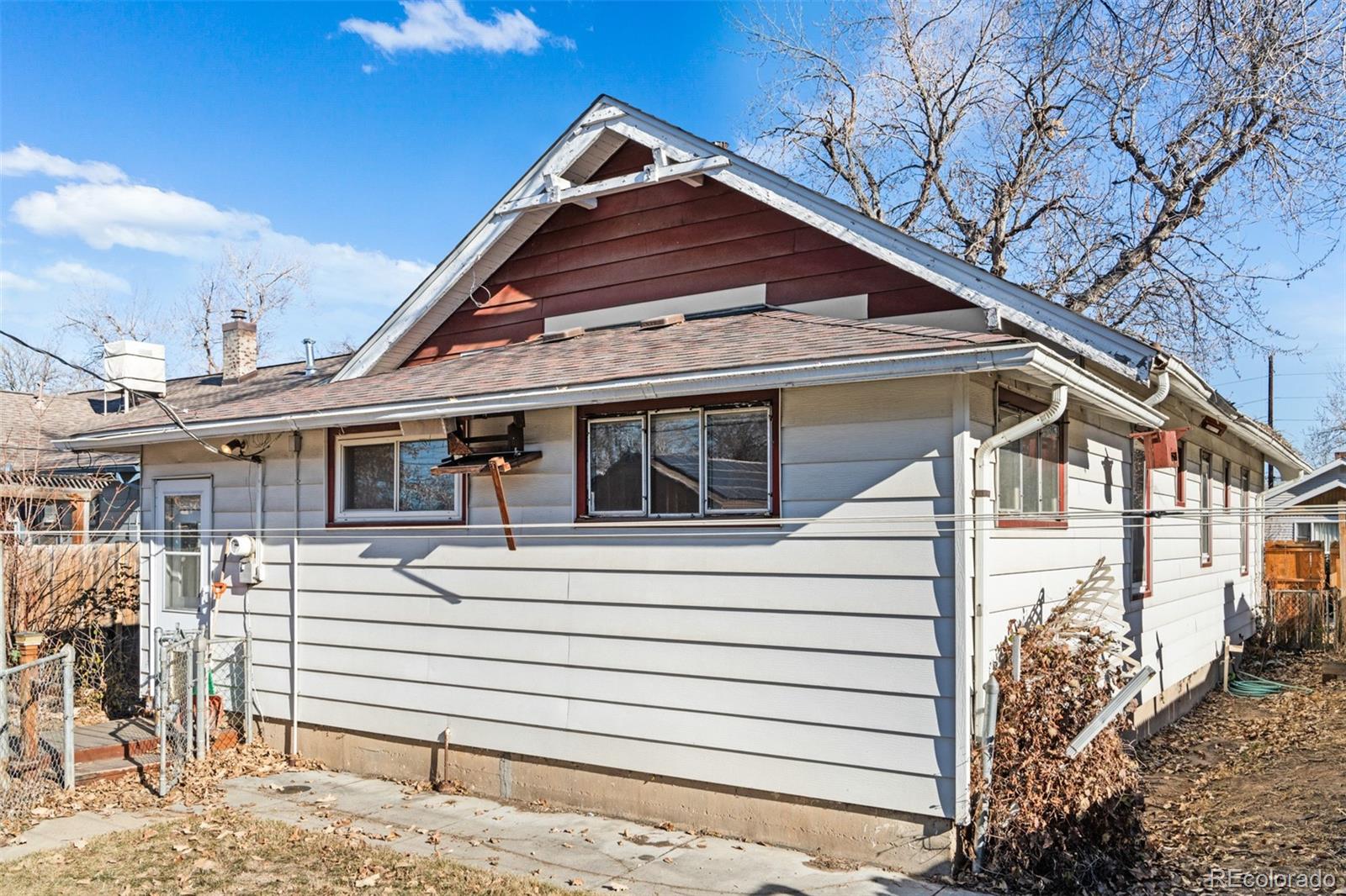 5919 South Bemis Street Littleton, CO 80120 - Photo 38 of 43 a view of a house with a roof deck