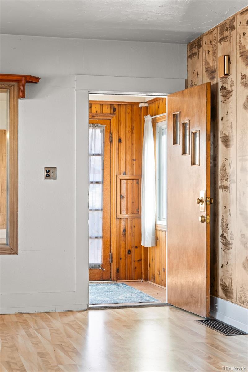 5919 South Bemis Street Littleton, CO 80120 - Photo 9 of 43 a view of a entryway with wooden floor