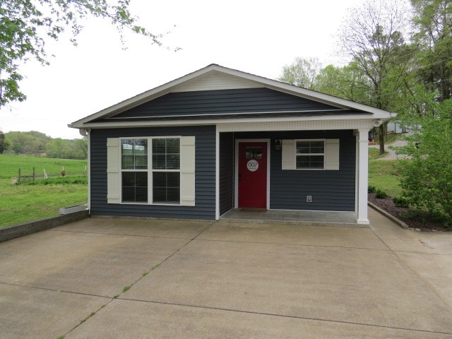 807 Clear Creek Road Pulaski, TN 38478 - Photo 1 of 19 a front view of a house with a yard