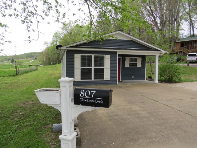 807 Clear Creek Road Pulaski, TN 38478 - Photo 11 of 19 a front view of a house with a yard