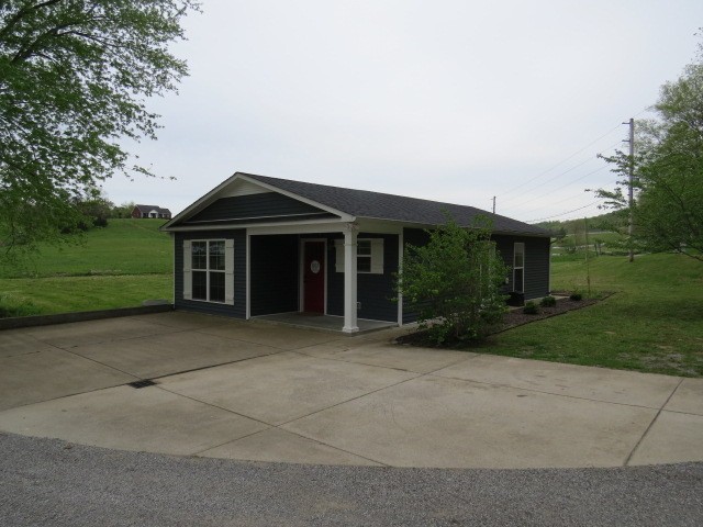 807 Clear Creek Road Pulaski, TN 38478 - Photo 2 of 19 a front view of a house with garden