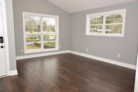 807 Clear Creek Road Pulaski, TN 38478 - Photo 7 of 19 an empty room with wooden floor and windows