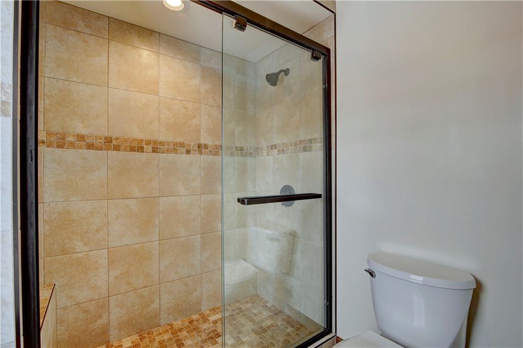 371 Alpine Road Dillon, CO 80435 - Photo 18 of 34 a bathroom with a glass shower door