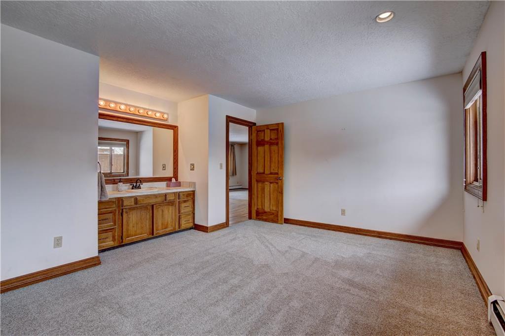 371 Alpine Road Dillon, CO 80435 - Photo 19 of 34 a view of an empty room with a window and kitchen view