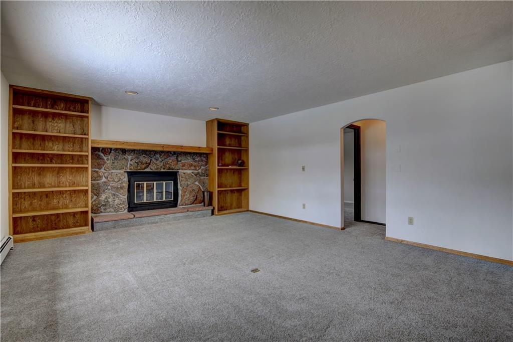 371 Alpine Road Dillon, CO 80435 - Photo 24 of 34 a view of an empty room with a fireplace