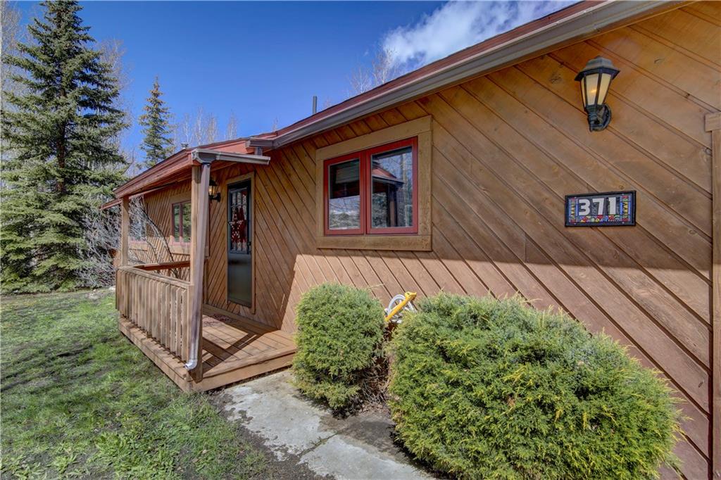 371 Alpine Road Dillon, CO 80435 - Photo 4 of 34 a front view of a house with garden