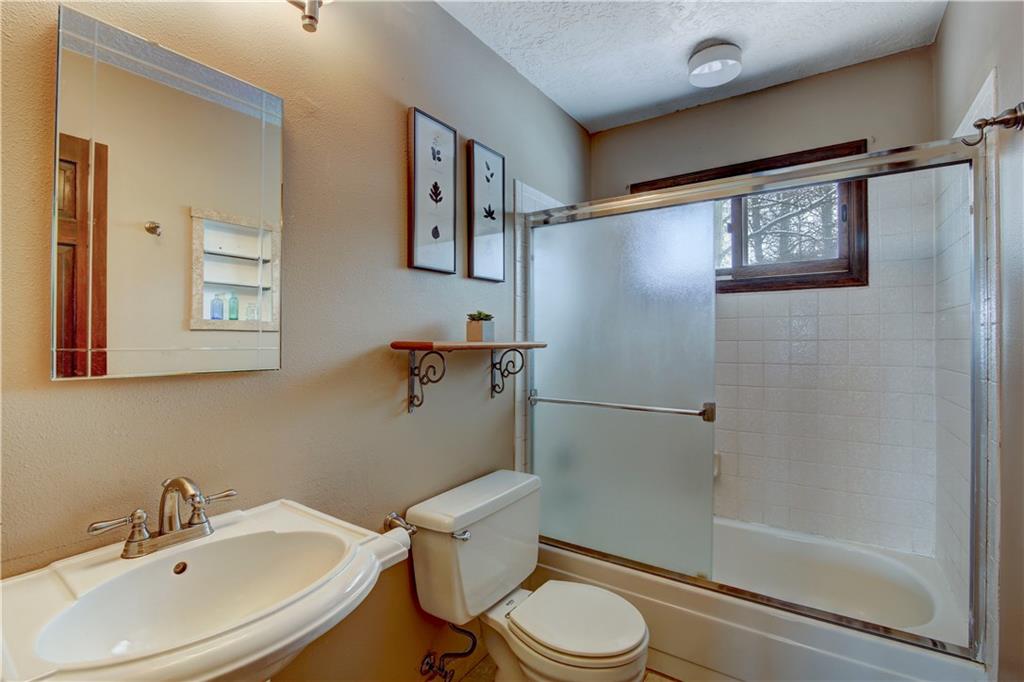 371 Alpine Road Dillon, CO 80435 - Photo 31 of 34 a white toilet sitting next to a bathroom sink
