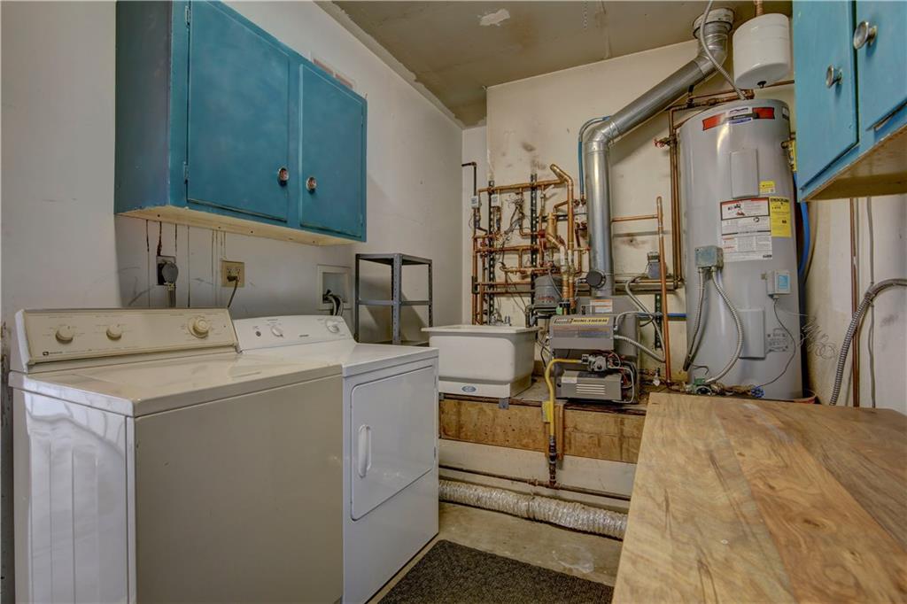 371 Alpine Road Dillon, CO 80435 - Photo 32 of 34 a utility room with dryer and washer