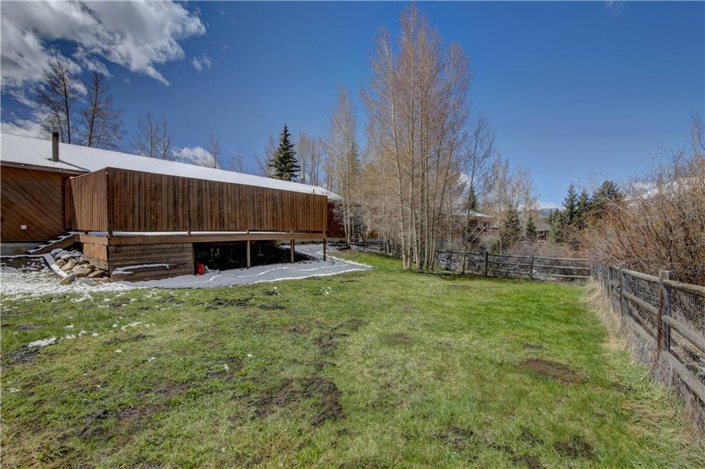 371 Alpine Road Dillon, CO 80435 - Photo 34 of 34 a view of backyard with wooden fence and large trees