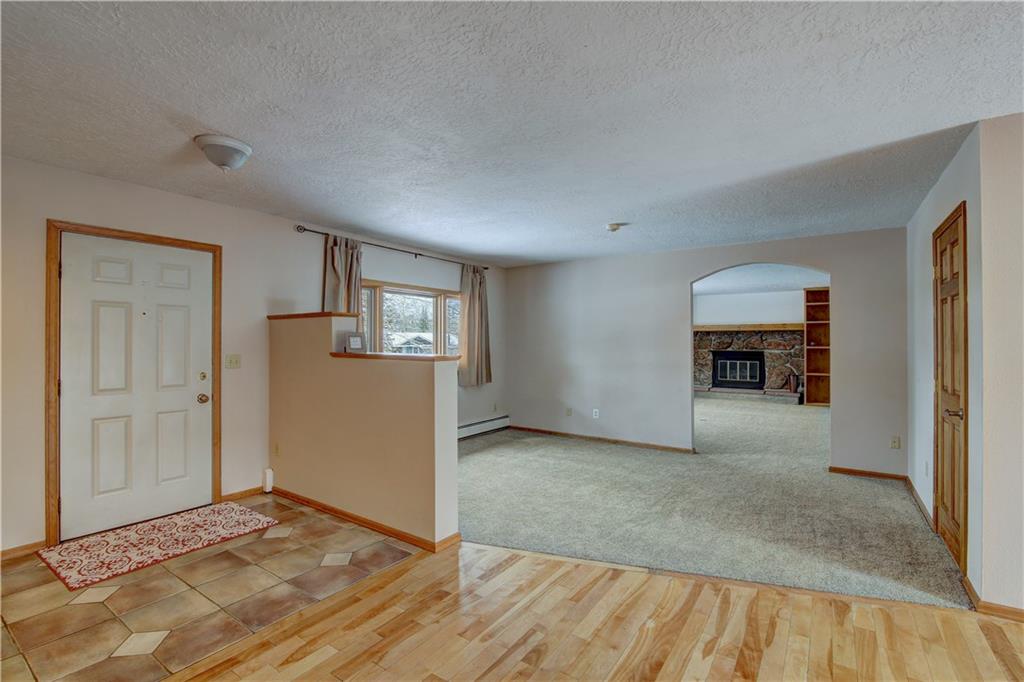 371 Alpine Road Dillon, CO 80435 - Photo 5 of 34 a view of a livingroom with wooden floor and a refrigerator