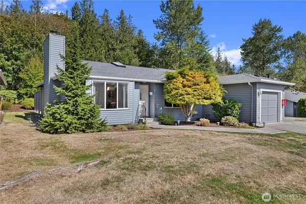 front view of a house with a yard