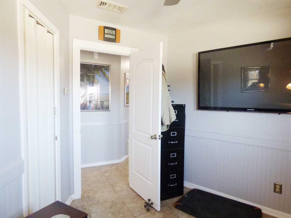 149 Bay Roc Lane Runaway Bay, TX 76426 - Photo 14 of 35 a view of a hallway with wooden floor and cabinet