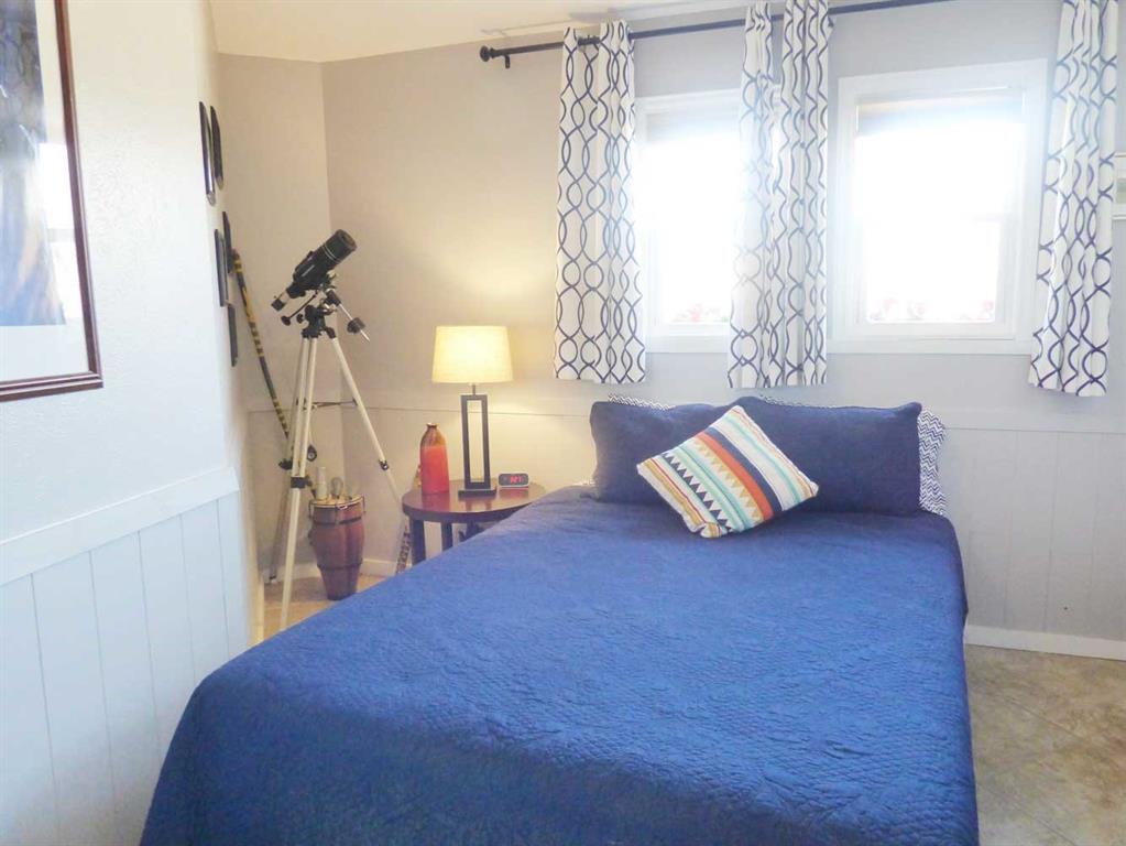 149 Bay Roc Lane Runaway Bay, TX 76426 - Photo 16 of 35 a living room with furniture and a chandelier