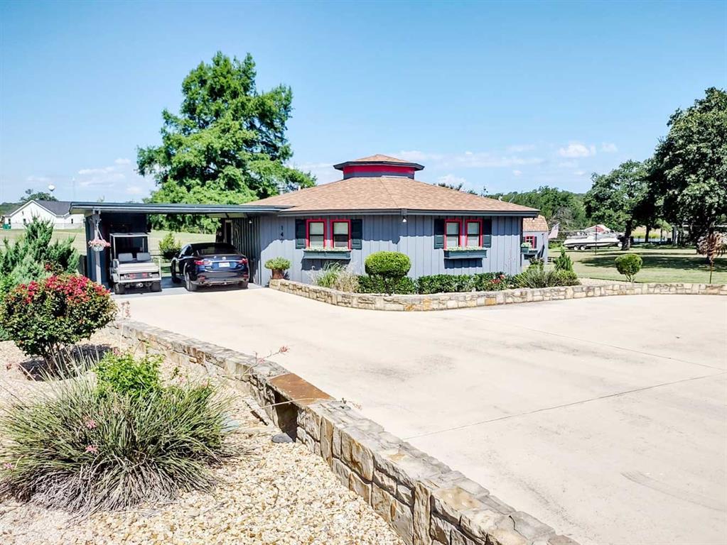 149 Bay Roc Lane Runaway Bay, TX 76426 - Photo 2 of 35 a view of house with outdoor space and porch