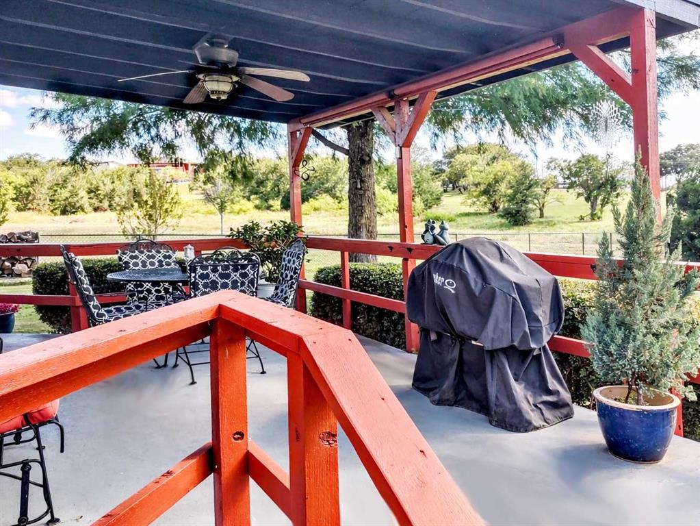 149 Bay Roc Lane Runaway Bay, TX 76426 - Photo 24 of 35 a view of patio with a table and chairs