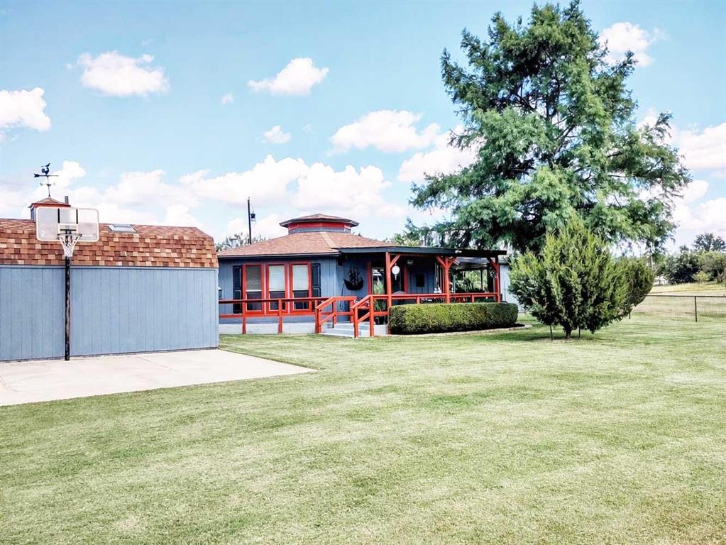 149 Bay Roc Lane Runaway Bay, TX 76426 - Photo 27 of 35 a view of a house with backyard and sitting area
