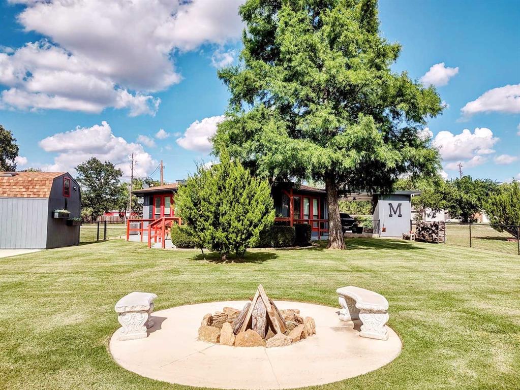 149 Bay Roc Lane Runaway Bay, TX 76426 - Photo 29 of 35 a swimming pool with outdoor seating and yard