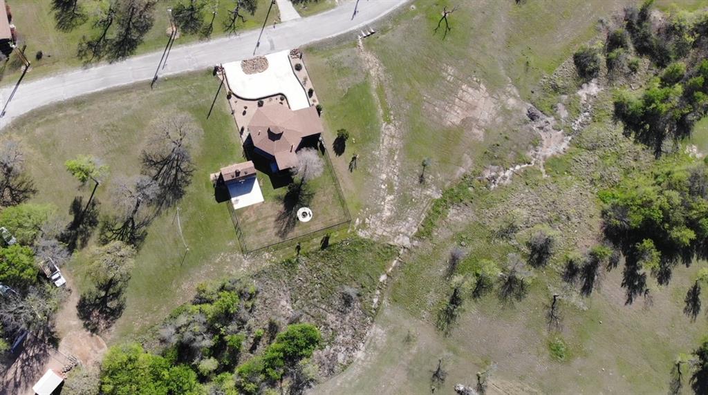 149 Bay Roc Lane Runaway Bay, TX 76426 - Photo 33 of 35 a aerial view of a house with a yard