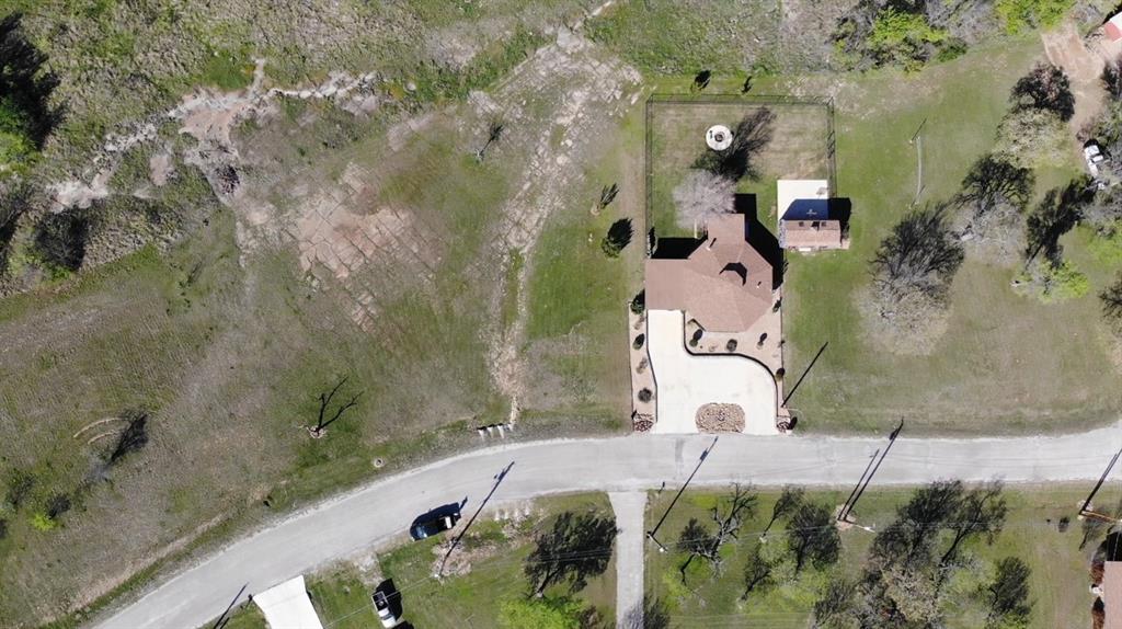 149 Bay Roc Lane Runaway Bay, TX 76426 - Photo 35 of 35 an aerial view of a house with a garden