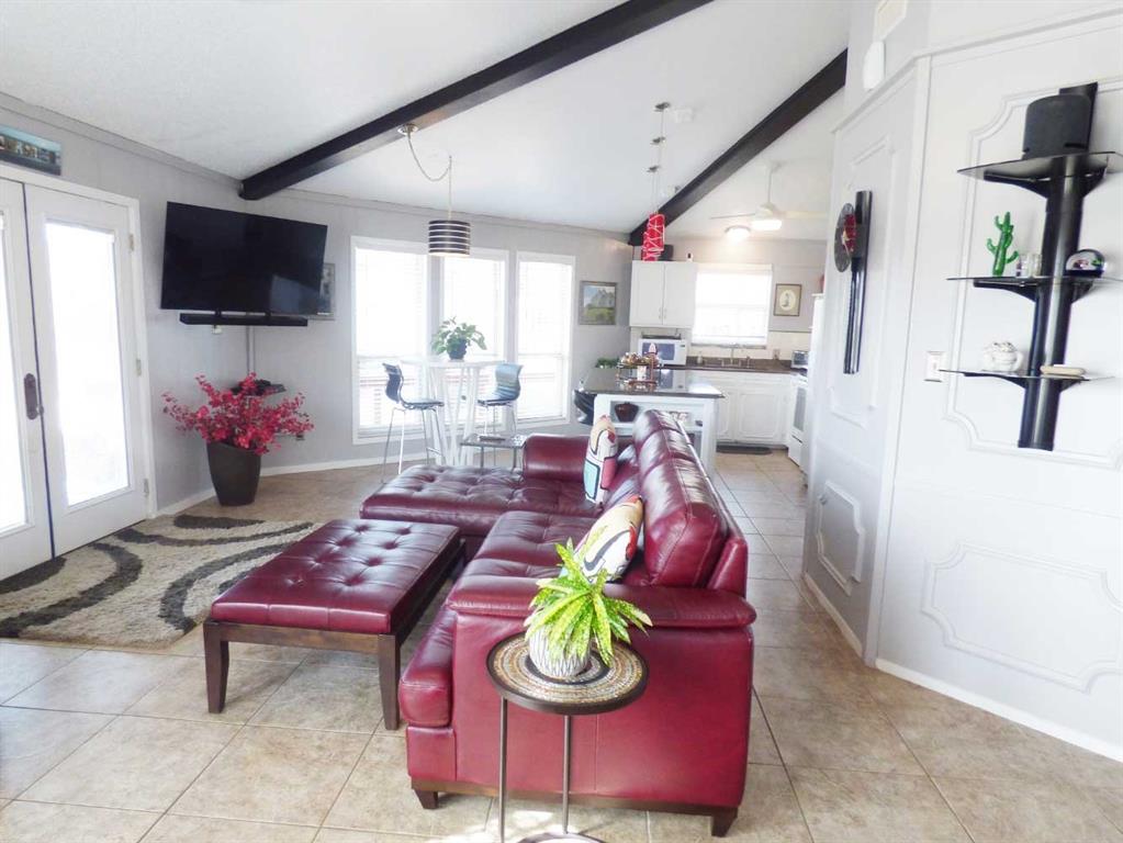 149 Bay Roc Lane Runaway Bay, TX 76426 - Photo 5 of 35 a living room with furniture and a flat screen tv