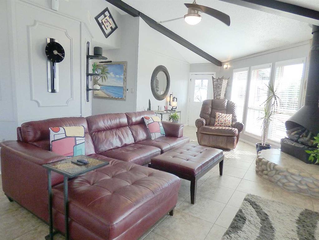 149 Bay Roc Lane Runaway Bay, TX 76426 - Photo 8 of 35 a living room with furniture and a large window