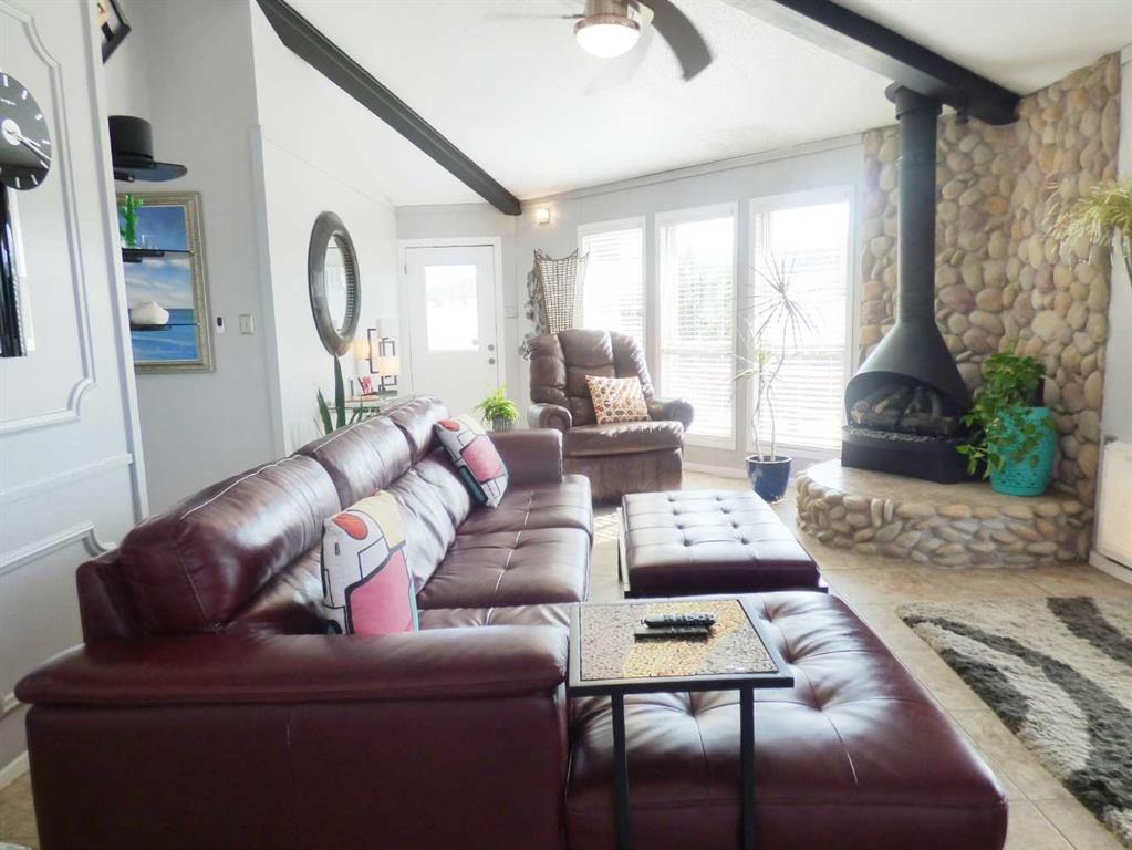 149 Bay Roc Lane Runaway Bay, TX 76426 - Photo 9 of 35 a living room with furniture and a large window