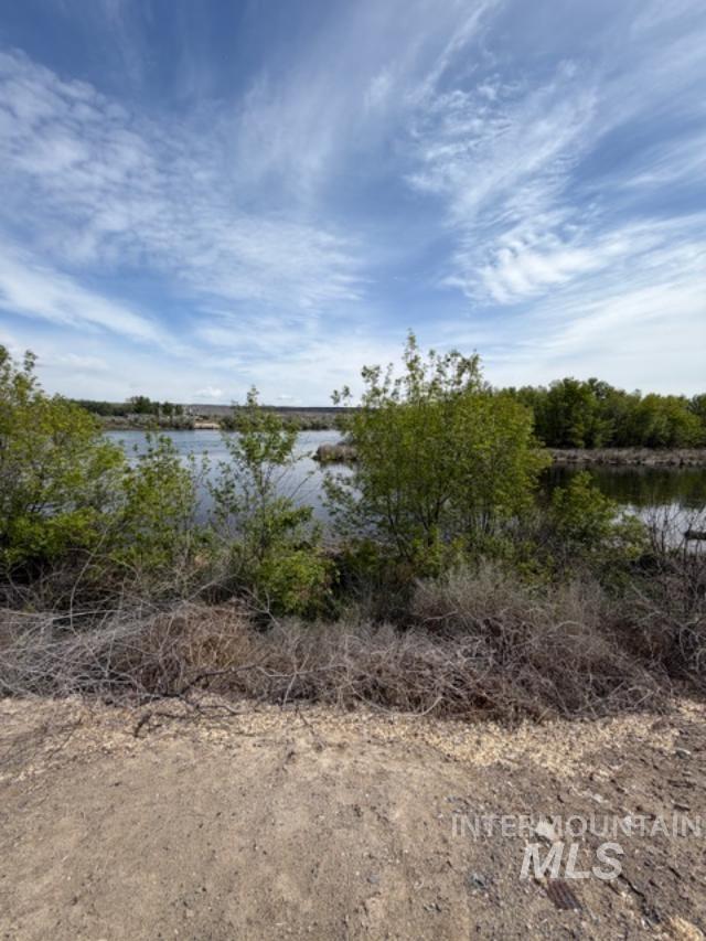 105 3rd Street Grand View, ID 83624 - Photo 2 of 19 Natural waterscape featuring a calm body of water bordered by varied foliage
