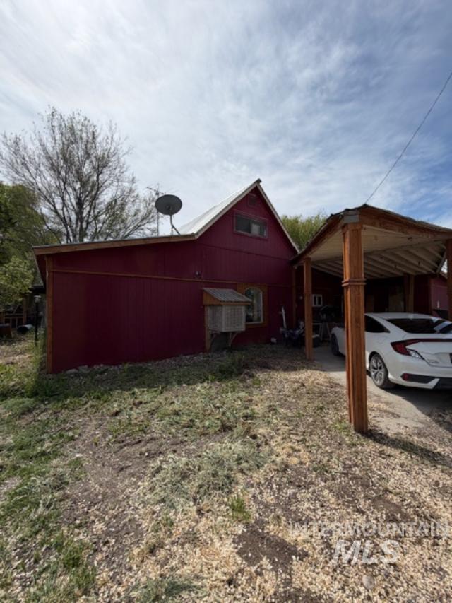 105 3rd Street Grand View, ID 83624 - Photo 4 of 19 Red corrugated metal siding exterior