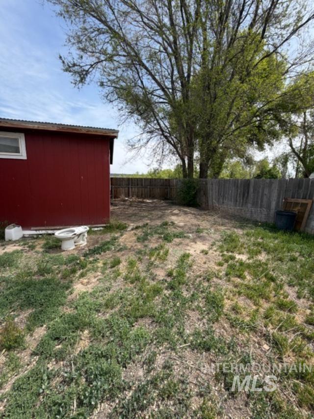 105 3rd Street Grand View, ID 83624 - Photo 7 of 19 Red exterior building with a corrugated metal roof