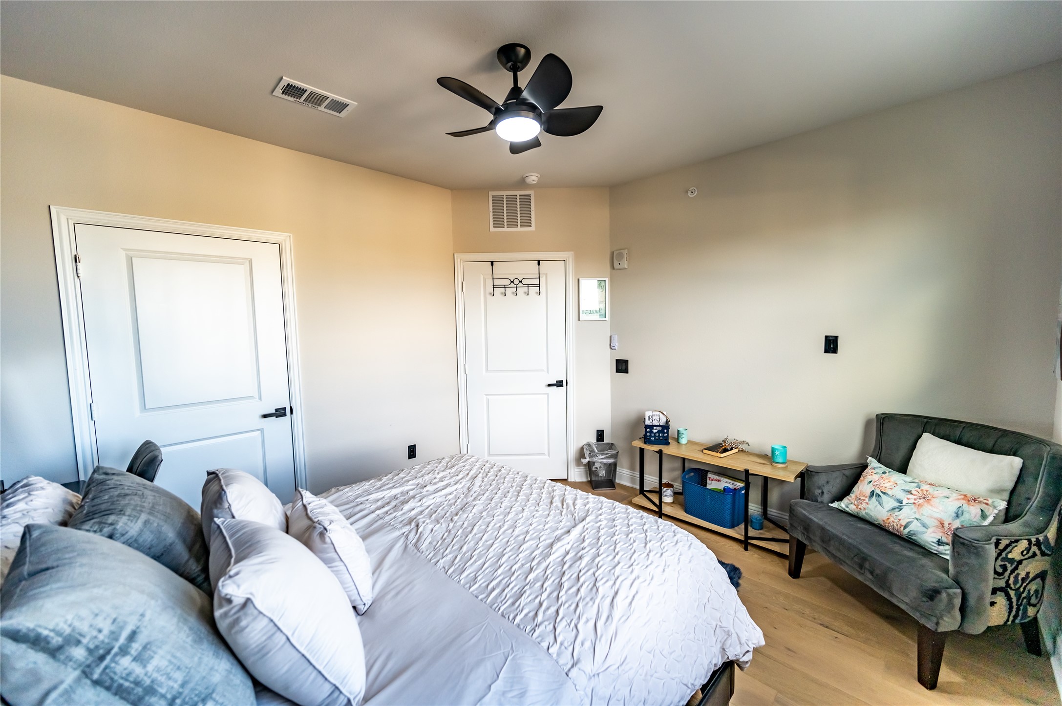 651 Watters Road, Unit 8201 Allen, TX 75013 - Photo 22 of 28 a bedroom with a bed and a chandelier