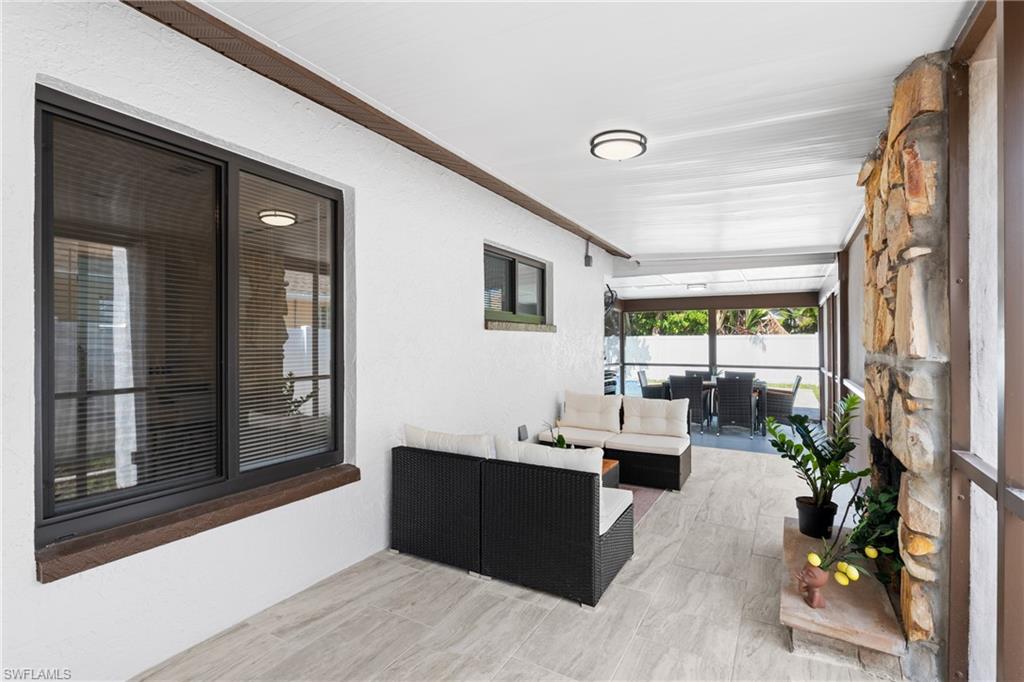 731 102nd Avenue North Naples, FL 34108 - Photo 15 of 23 a living room with furniture and a large window