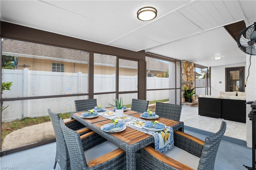 731 102nd Avenue North Naples, FL 34108 - Photo 17 of 23 a view of a dining room with furniture large windows and wooden floor