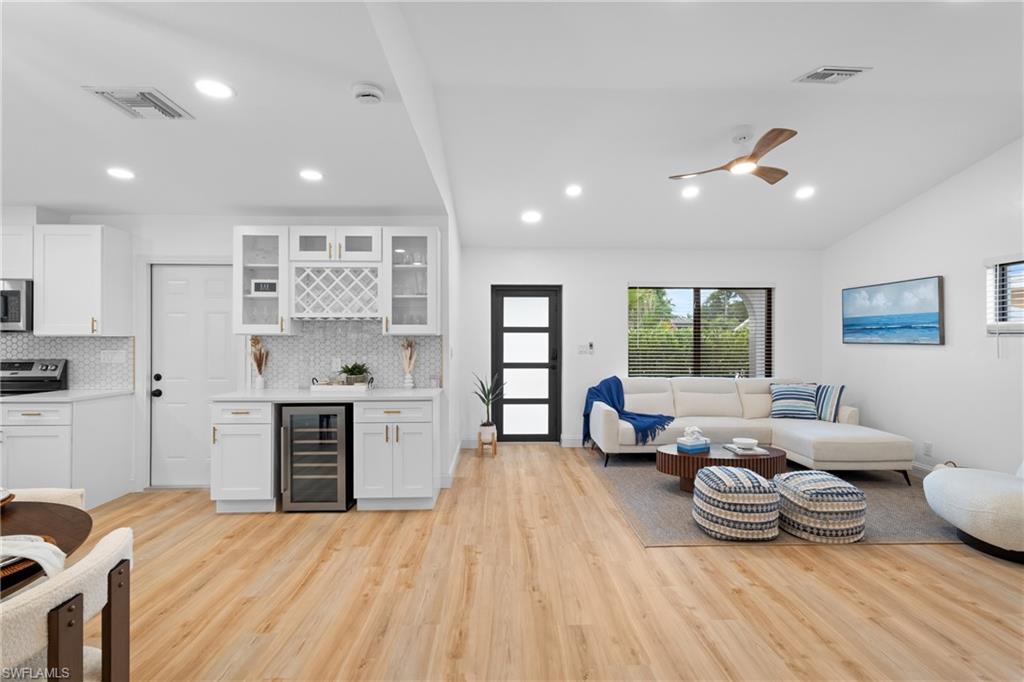731 102nd Avenue North Naples, FL 34108 - Photo 2 of 23 a kitchen with sink refrigerator and stove