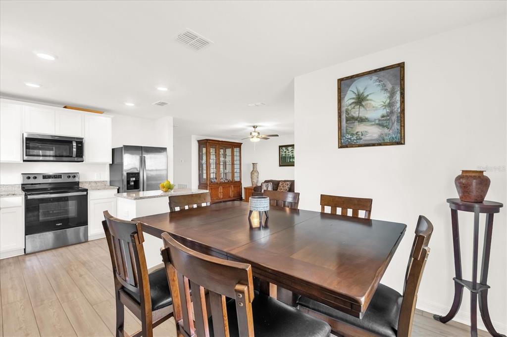2134 Rio Grande Canyon Loop Poinciana, FL 34759 - Photo 2 of 22 a open dining room with furniture and window
