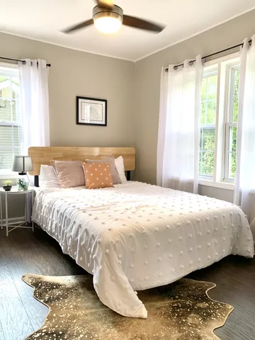 a bedroom with a bed and a window