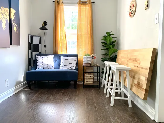 a bedroom with furniture and a window