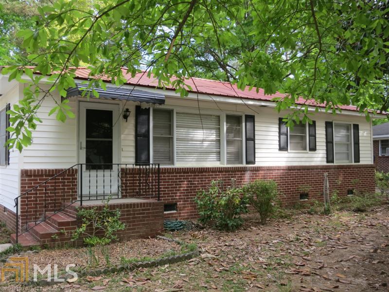 58 Rooney Road Southwest, Unit 65 Rome, GA 30165 - Photo 1 of 1 a front view of a house with garden