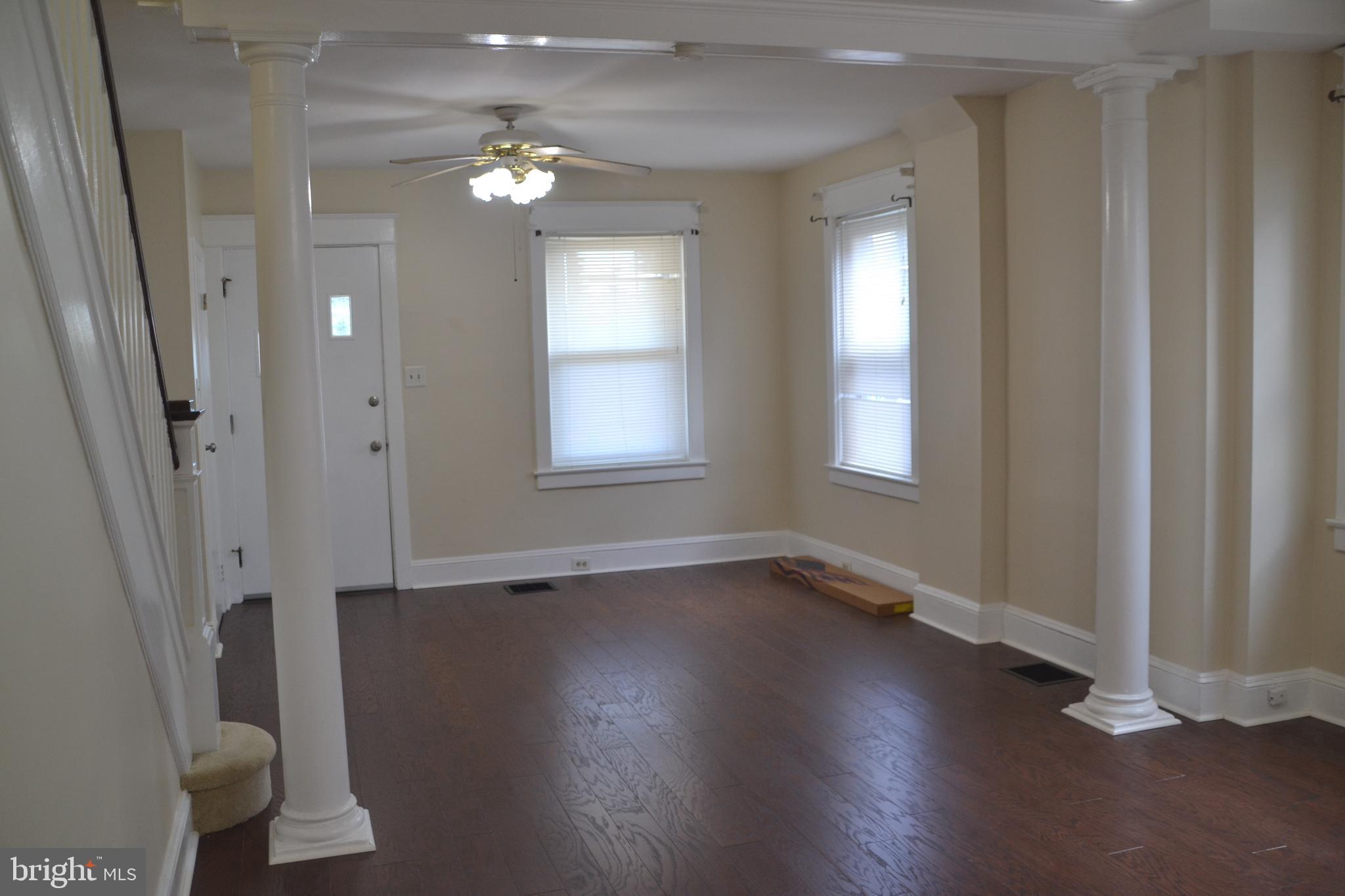162 Burmont Road Drexel Hill, PA 19026 - Photo 15 of 42 an empty room with wooden floor and windows