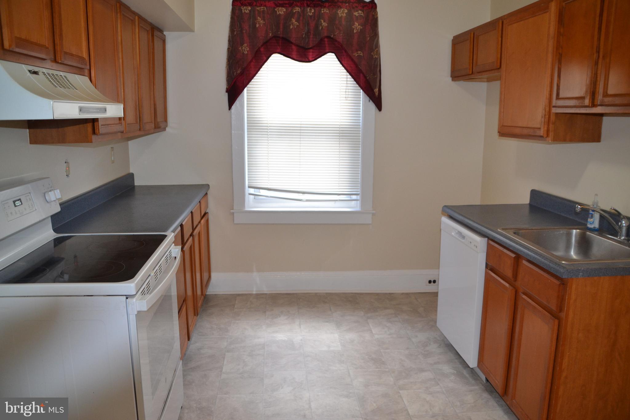 162 Burmont Road Drexel Hill, PA 19026 - Photo 18 of 42 a kitchen that has a sink and a stove