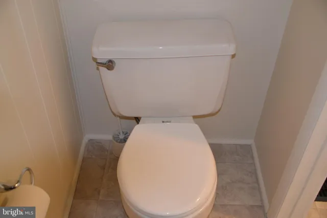 a bathroom with a toilet and a sink