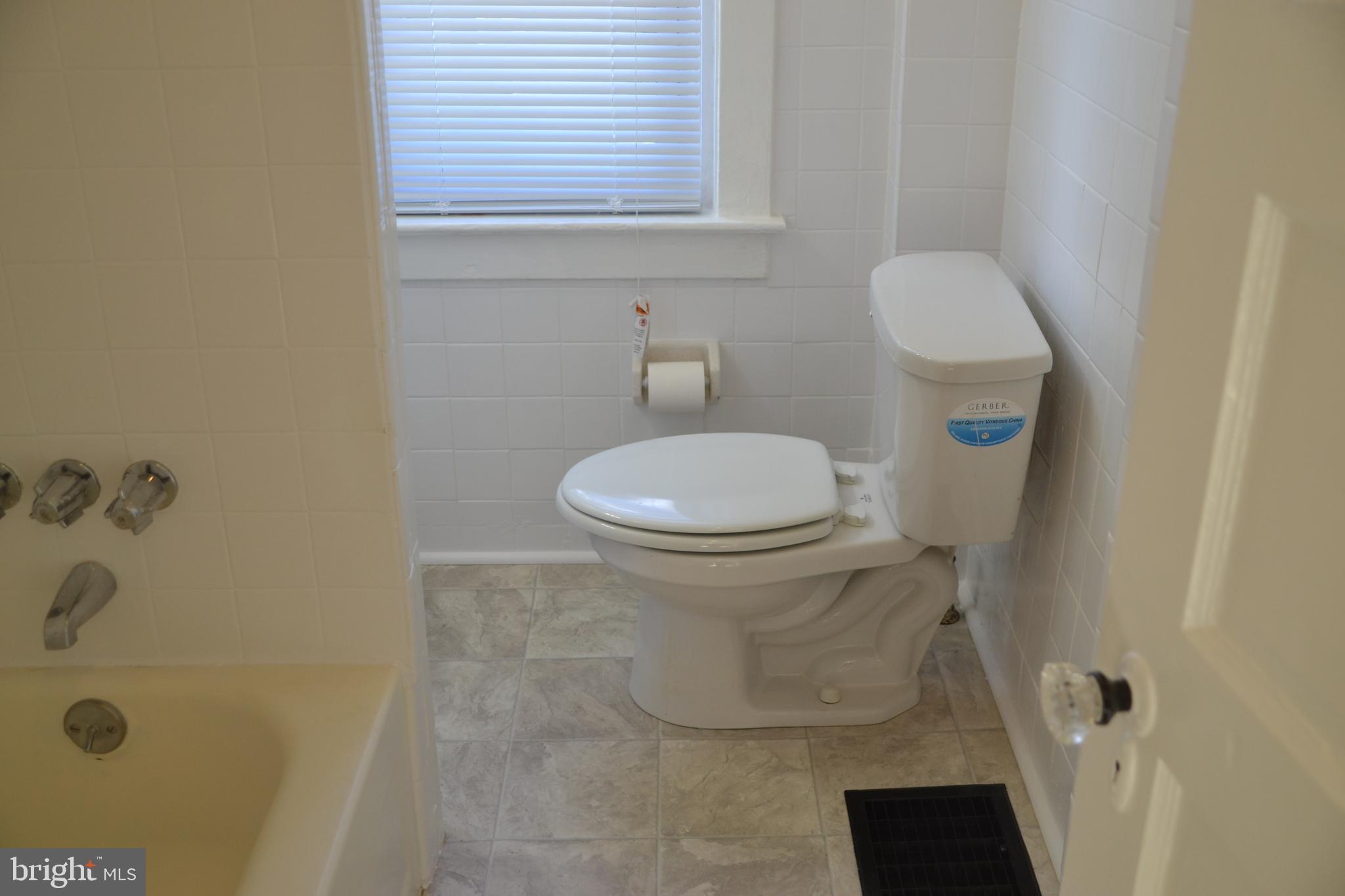 162 Burmont Road Drexel Hill, PA 19026 - Photo 40 of 42 a bathroom with a toilet and a shower