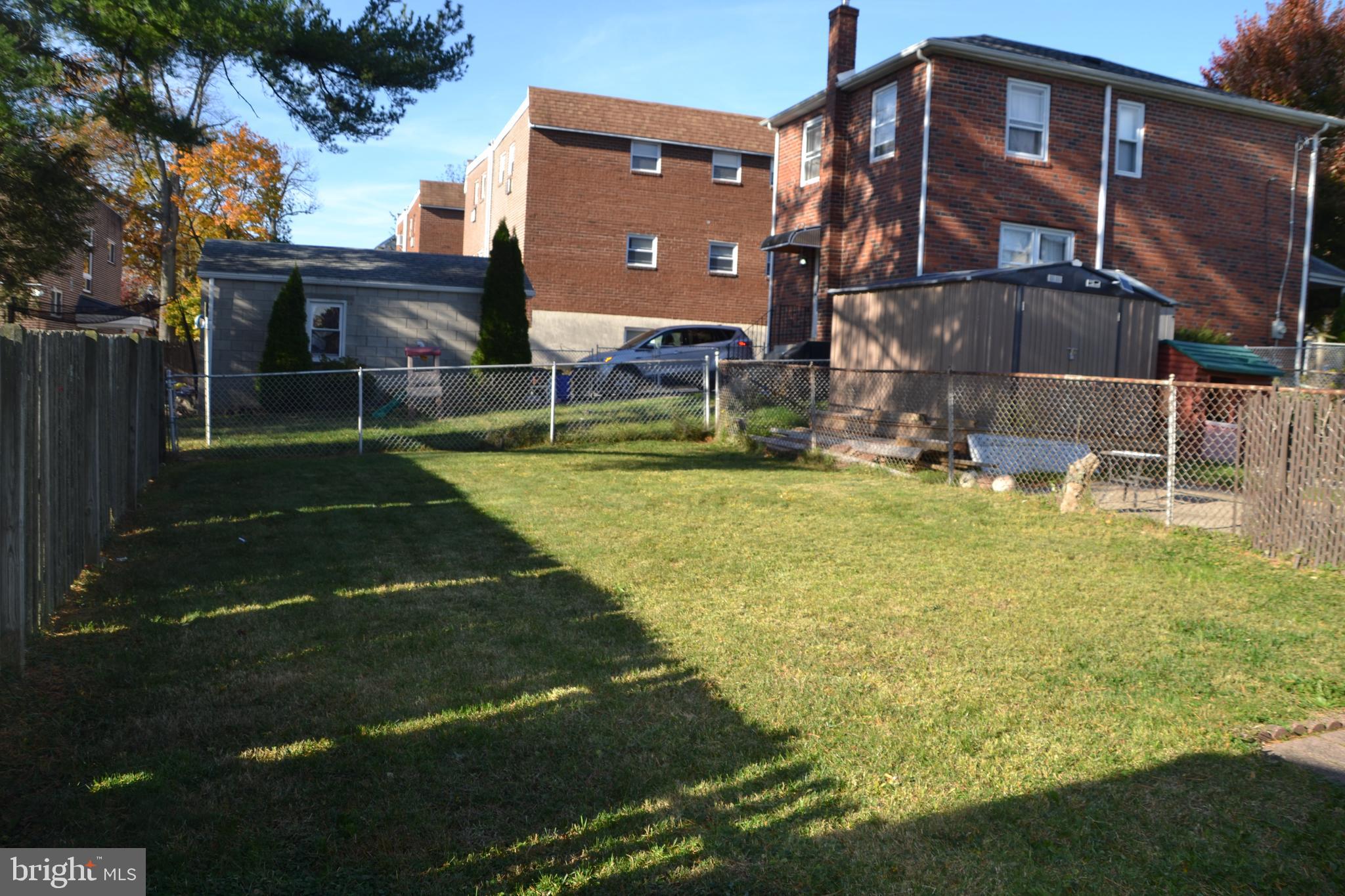 162 Burmont Road Drexel Hill, PA 19026 - Photo 4 of 42 a backyard of a house with table and chairs