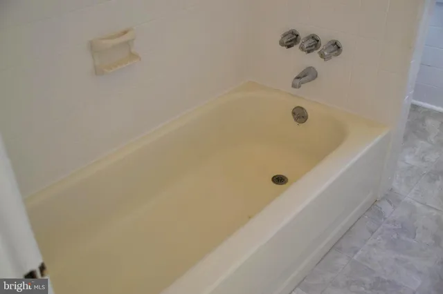 a white sink sitting next to a white sink