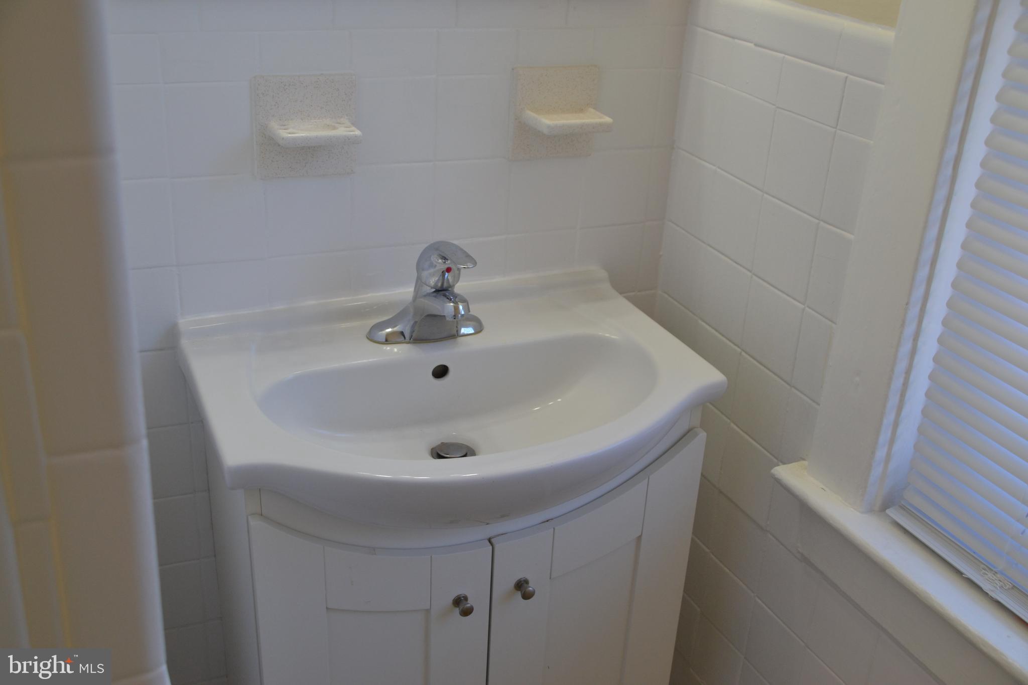 162 Burmont Road Drexel Hill, PA 19026 - Photo 42 of 42 a white sink sitting next to a white sink