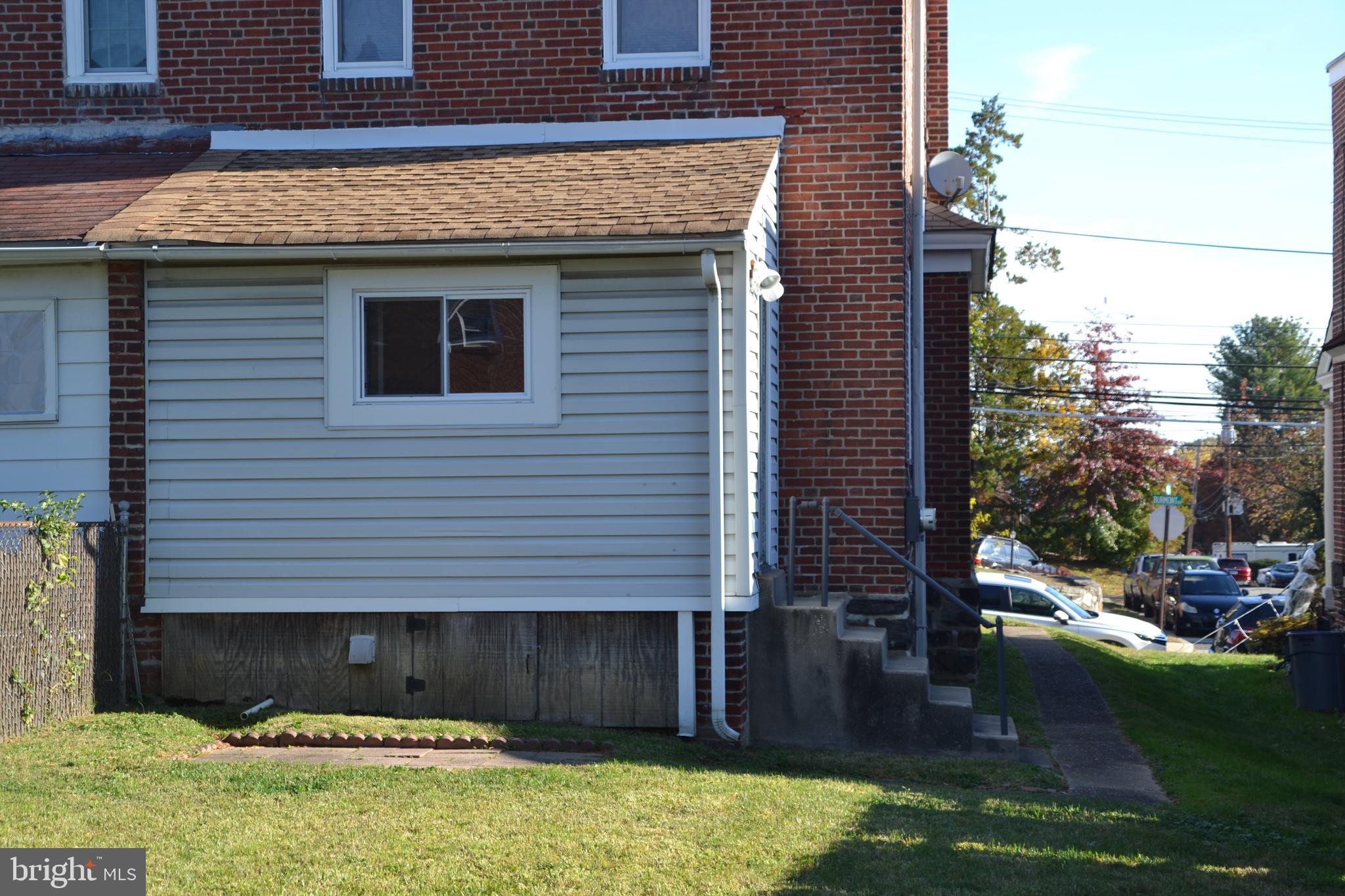 162 Burmont Road Drexel Hill, PA 19026 - Photo 5 of 42 a front view of a house with a yard