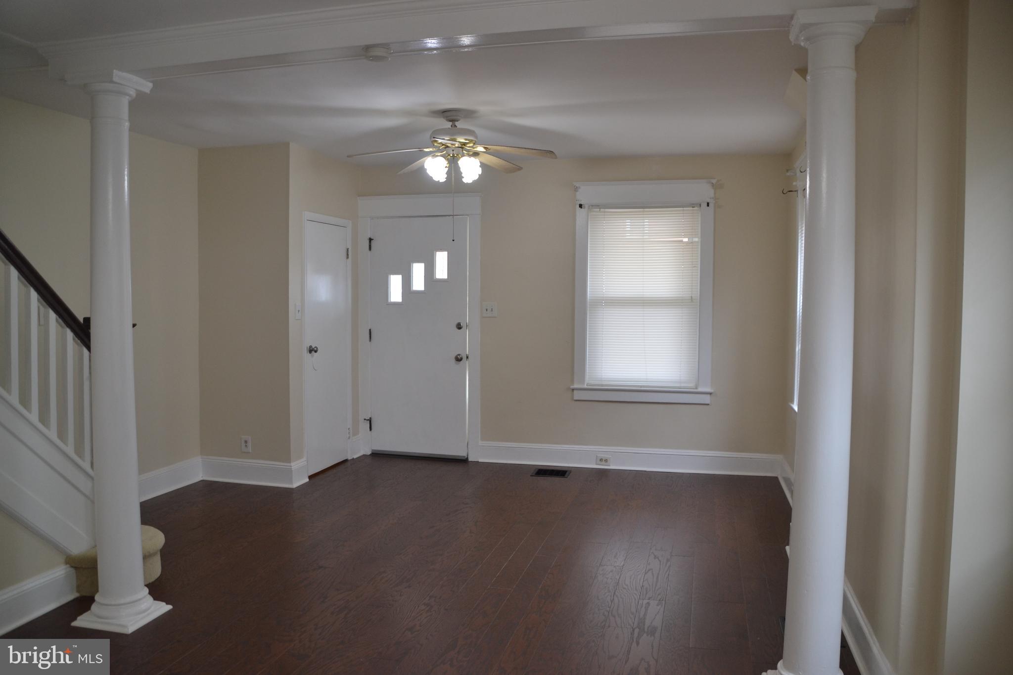 162 Burmont Road Drexel Hill, PA 19026 - Photo 9 of 42 an empty room with wooden floor and windows