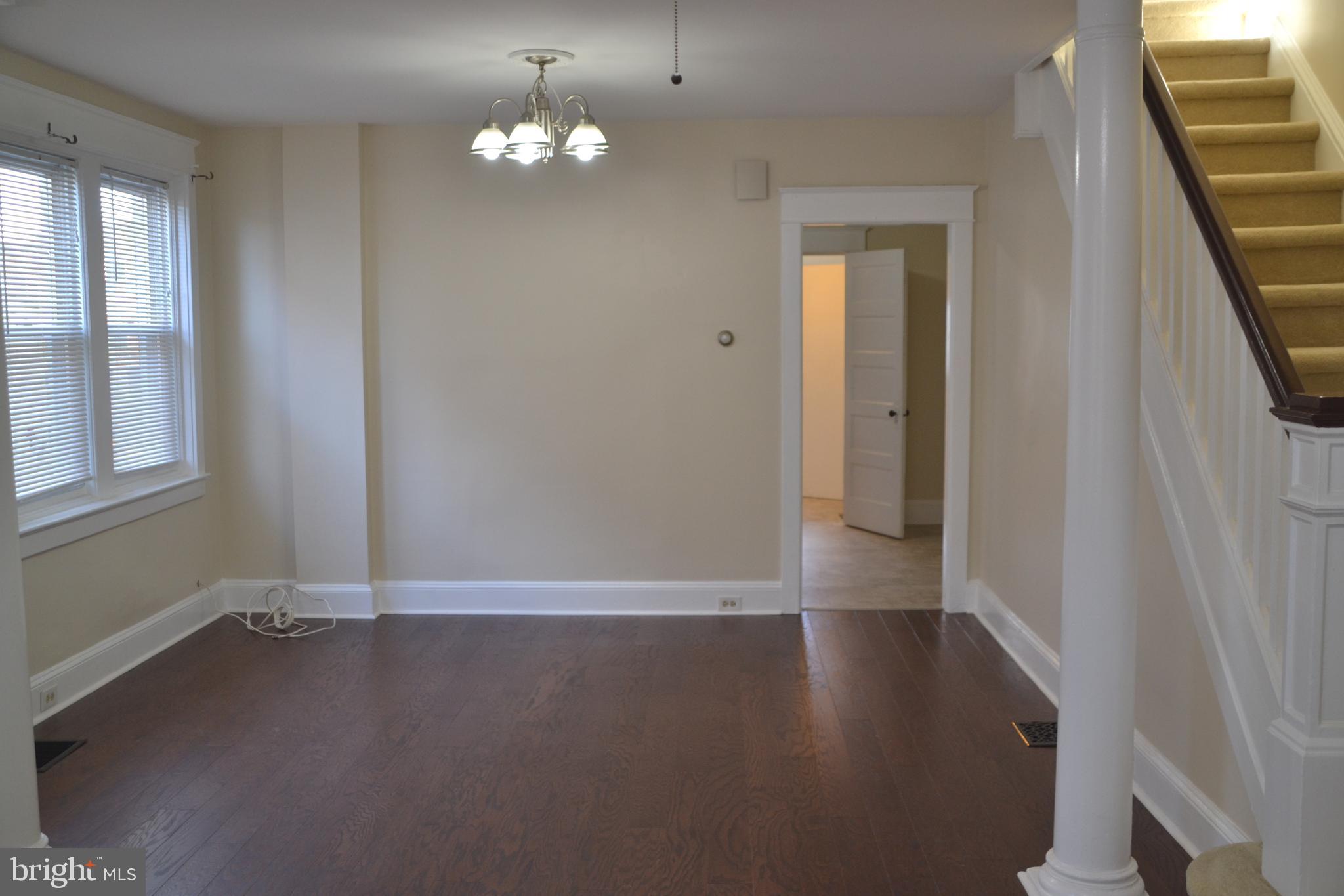 162 Burmont Road Drexel Hill, PA 19026 - Photo 10 of 42 an empty room with wooden floor and windows